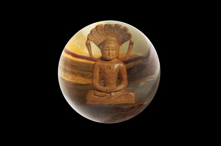 Buddha and stone ball on black background