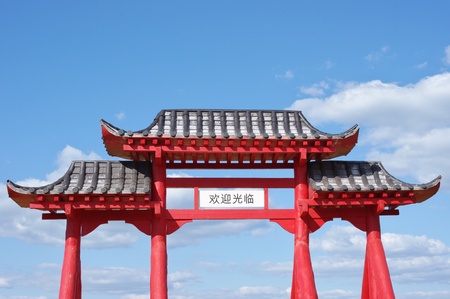 Gate of Buddhist temple and blue sky with cloudsの写真素材
