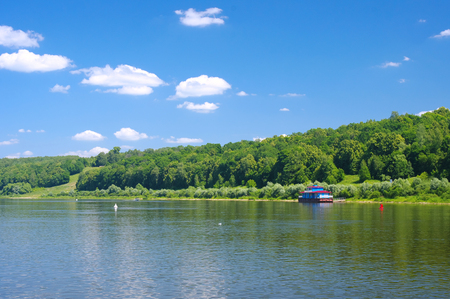 Old pier on a quiet river in summerの写真素材