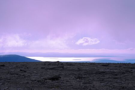 View from the mountain plateau to the distant lake