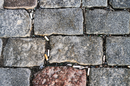 Large stone blocks and a lot of cigarette butts texture