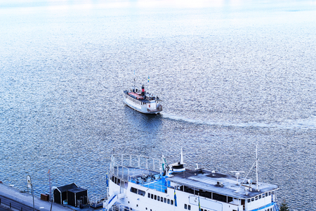 Departure ferry in Stockholm on the bay at sunset Riddarfordenの写真素材