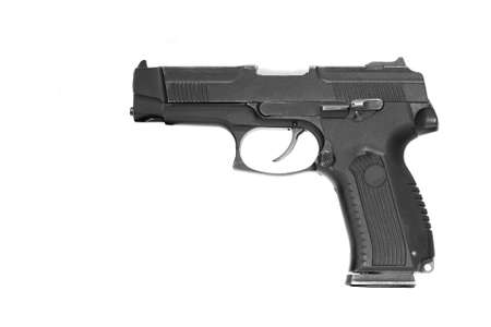 isolated combat black pistol with cartridges on a white backgroundの写真素材