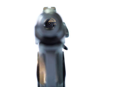 isolated combat black pistol with cartridges on a white backgroundの写真素材