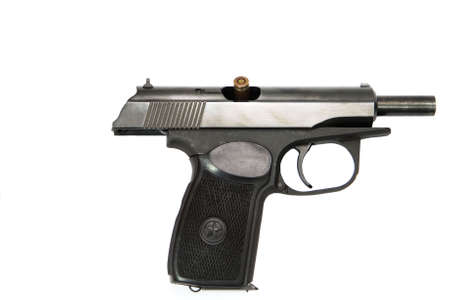 isolated combat black pistol with cartridges on a white backgroundの写真素材