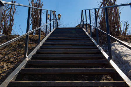 a pedestrian staircase that goes up to the skyの写真素材