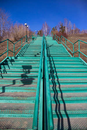 a pedestrian staircase that goes up to the skyの写真素材