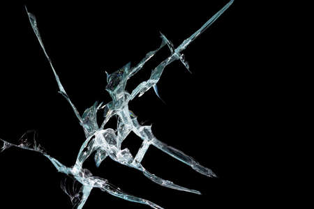 broken mirror glass on a black background in cracks in the form of an isolated image abstractionの写真素材