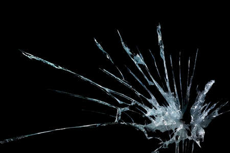 broken glass mirror in the form of cracks and lines on a black isolated backgroundの写真素材