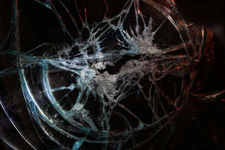 broken mirror glass cracks in the form of lines and abstractions on an isolated black backgroundの写真素材