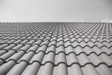 tiles on the roof of the building against the sky in the form of straight lines