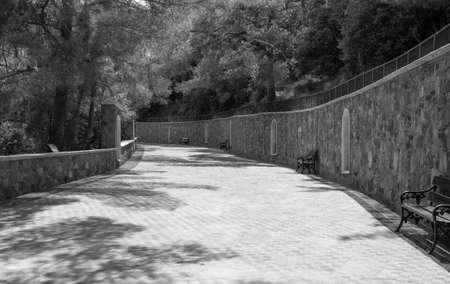 ancient masonry of cobblestones and stones for the sidewalk wall and road, street of the ancient cityの写真素材