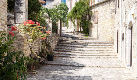 ancient masonry of cobblestones and stones for the sidewalk wall and road, street of the ancient...
