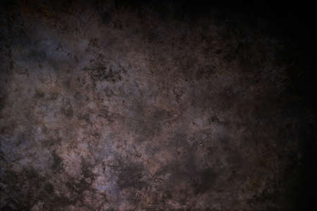 Dark brown stone or metal background. The texture of the surface of the stone or metal table or wall. Background for design, menu and text tiles.の写真素材