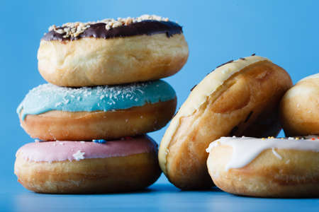 Closeup colorful donuts on shadeless backgroundの写真素材