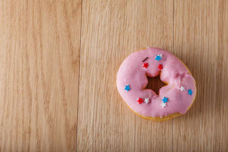 Pink donut on tableの写真素材