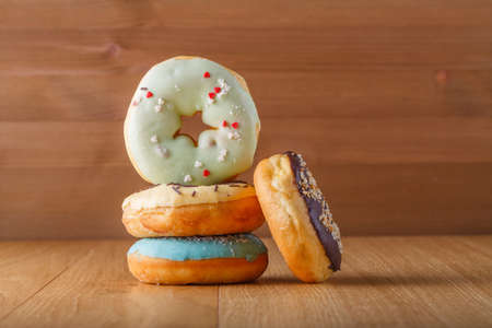 Colorful donuts standing on tableの写真素材