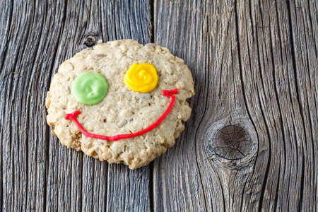 Oat cookies on rustic wooden table, smileの写真素材