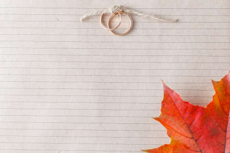Invitation wedding card with two golden rings and place for inscriptionの写真素材
