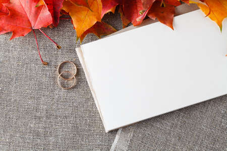 Invitation wedding card with golden rings and place for inscription. Decoration ideaの写真素材