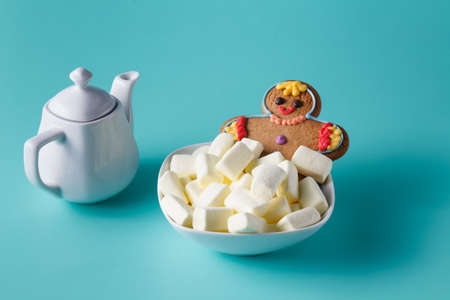 Gingerbread man swim in marshmallowの写真素材