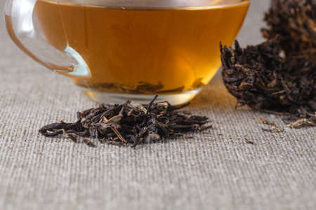 Tea in glass cuo. Chinese tea Puer, closeupの写真素材
