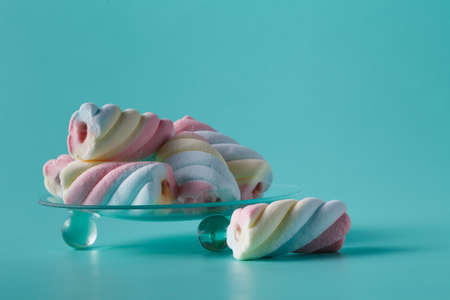 Twisted marshmallow on vibrant backgroundの写真素材