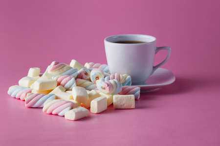 Morning tea cup with dropped out colored confectionの写真素材