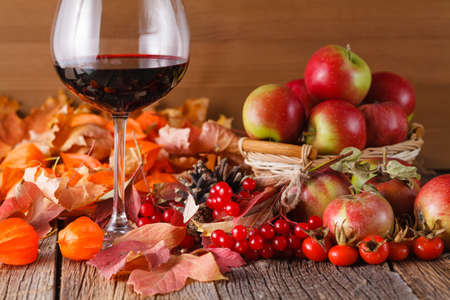 Fall wine with harvesting on rustic wooden backgroundの写真素材