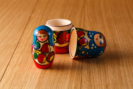 Russian traditional matreshka on wooden tableの写真素材