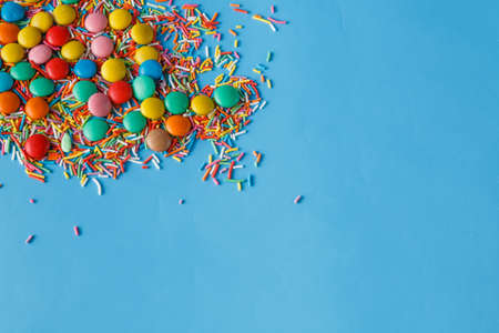 Bright candy on blue backgroundの写真素材