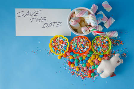 Kid holiday invitation. Colored candy and mug with note save the date