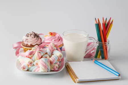 breakfast with sweets and milk mug on white background