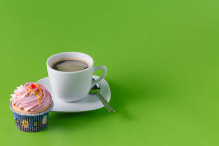Breakfast unhealthy sweets concept. Cupcakes with coffeeの写真素材
