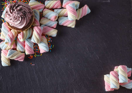 Fun sweet frame on slate black background for text placement. Top viewの写真素材