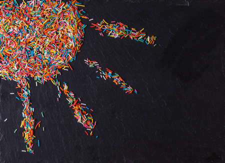 Fun sweet frame on slate black background for text placement. Top viewの写真素材