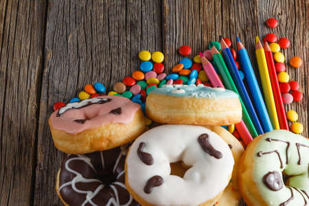 Halloween donuts on rustic wooden tableの写真素材