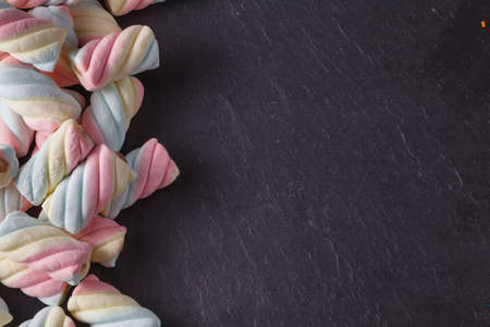 Fun sweet frame on slate black background for text placement. Top viewの写真素材