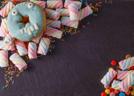 Fun sweet frame on slate black background for text placement. Top viewの写真素材