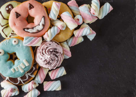 Fun sweet frame on slate black background for text placement. Top viewの写真素材