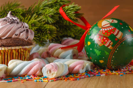 Christmas concept. Closeup pine with twisted american marshmallowの写真素材