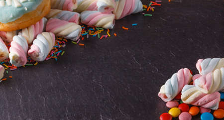 Fun sweet frame on slate black background for text placement. Top viewの写真素材