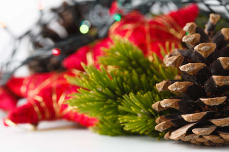 New Year and Christmas scene decoration with pine, cones and stars on white backgroundの写真素材
