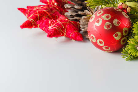 New Year and Christmas scene decoration with pine, cones and stars on white backgroundの写真素材