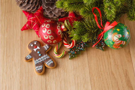 New year decoration on wood table with pine, sweets and red starsの写真素材