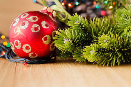 New year decoration on wood table with pine, sweets and red starsの写真素材