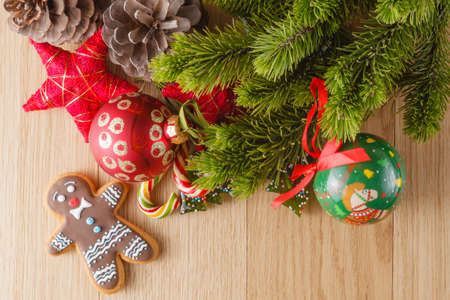 New year decoration on wood table with pine, sweets and red starsの写真素材