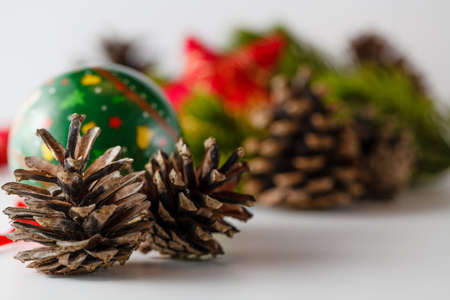 New Year and Christmas scene decoration with pine, cones and stars on white backgroundの写真素材