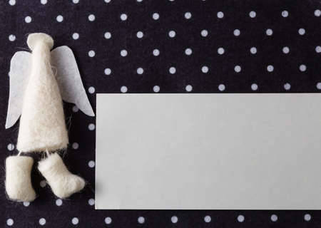 Kid greeting card concept. Felt doll on colorful background wit copy spaceの写真素材