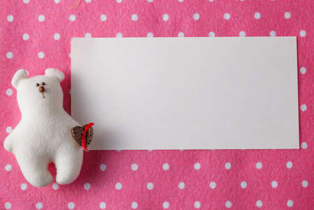 Kid greeting card concept. Felt doll on colorful background wit copy spaceの写真素材